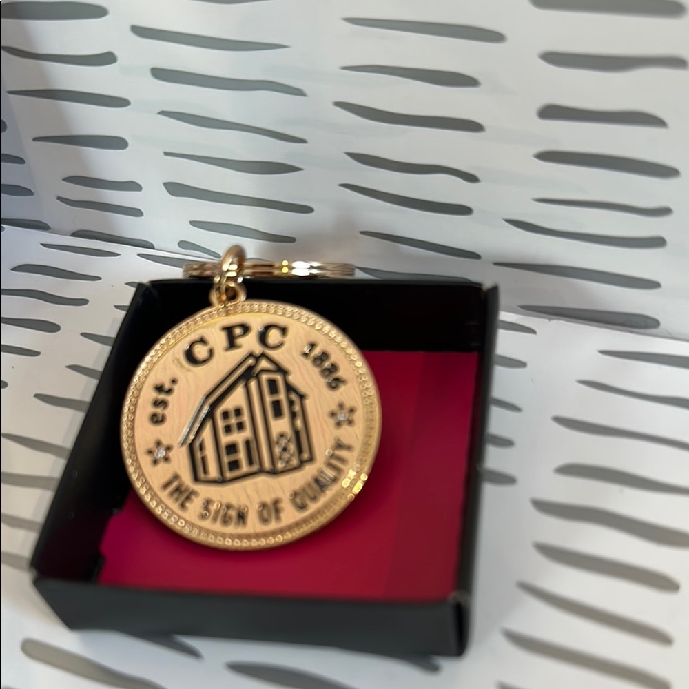 Avon 135th Anniversary Coin Key Chain